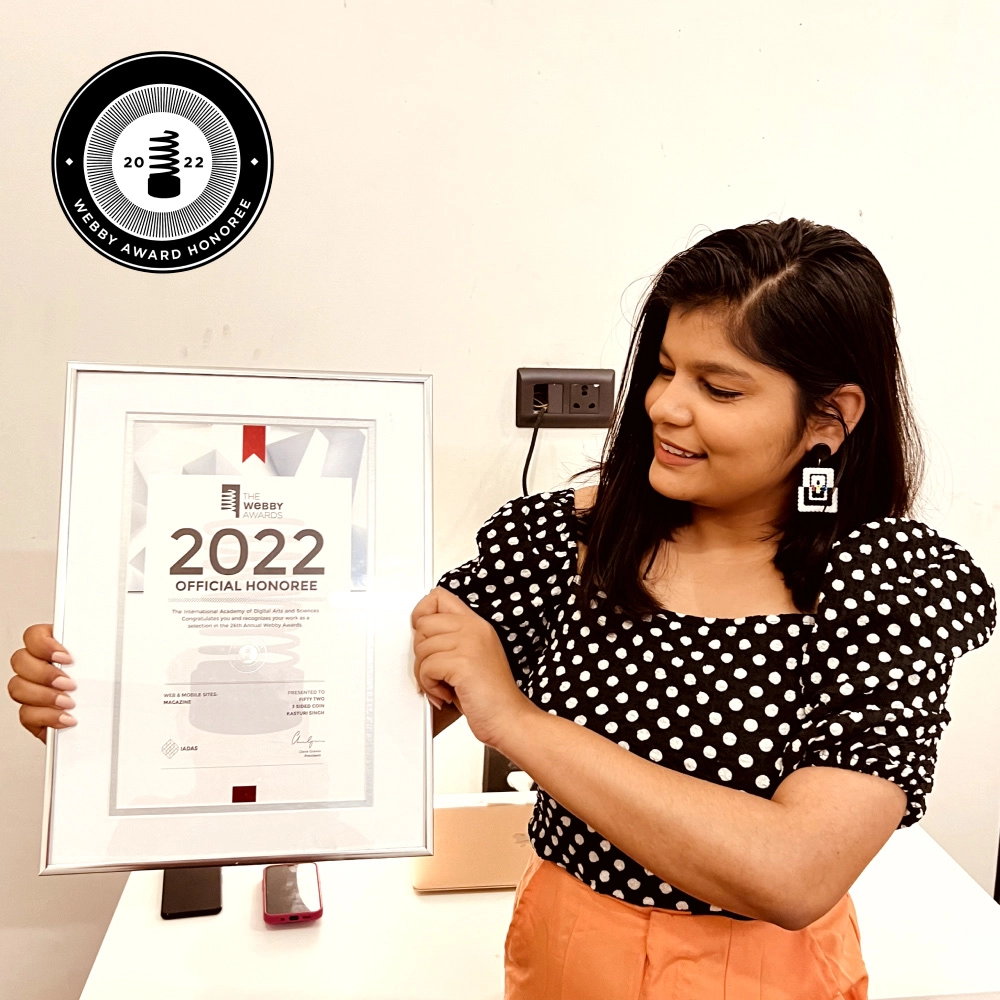 kasturi posing with her Webby certificate